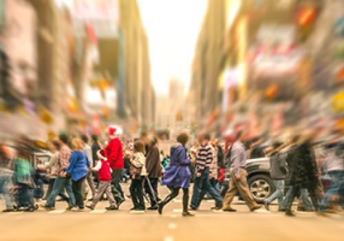 Melting pot people walking on zebra crossing and traffic jam on 7th avenue in Manhattan before sunset - Crowded streets of New York City during rush hour in urban business area